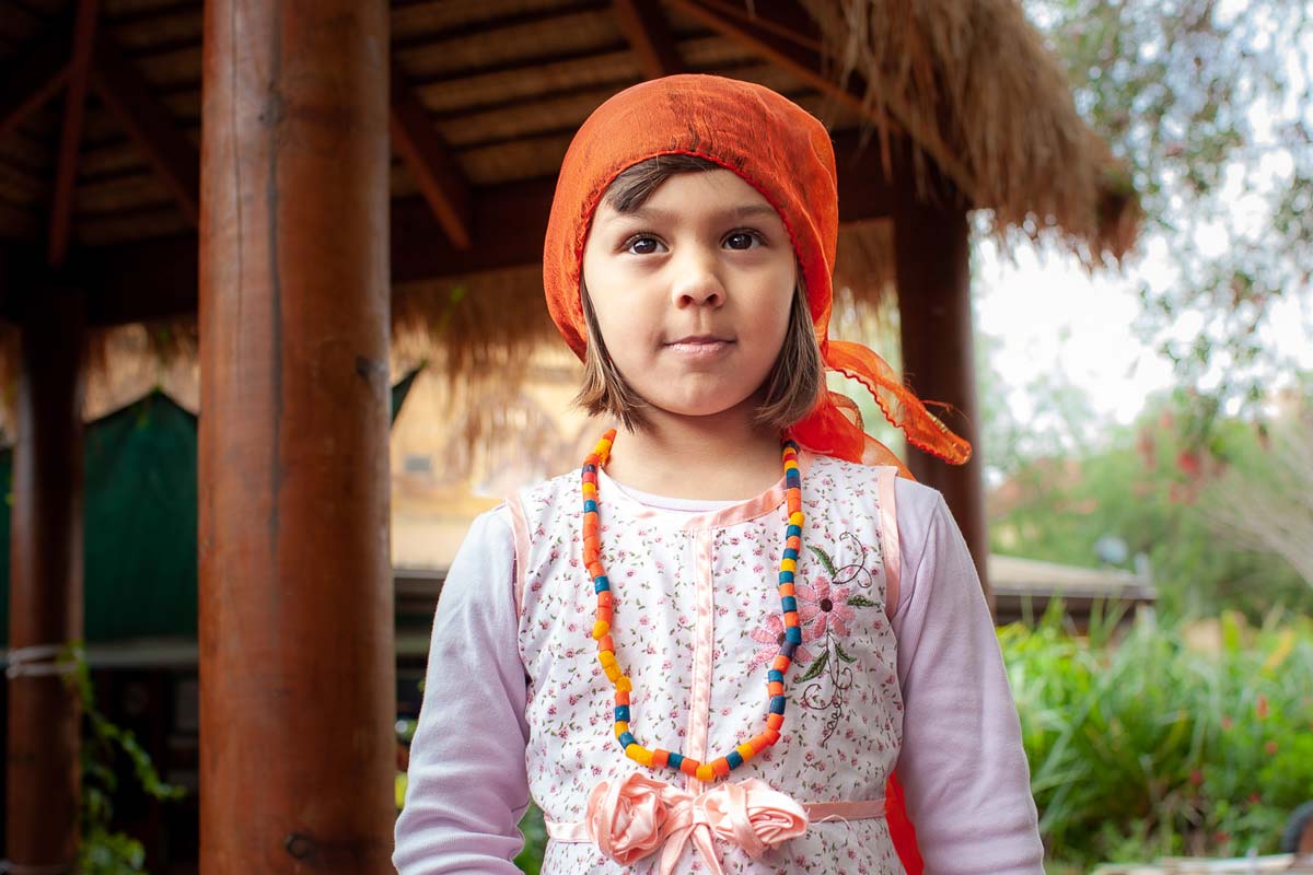 A young girl looking outwards.
